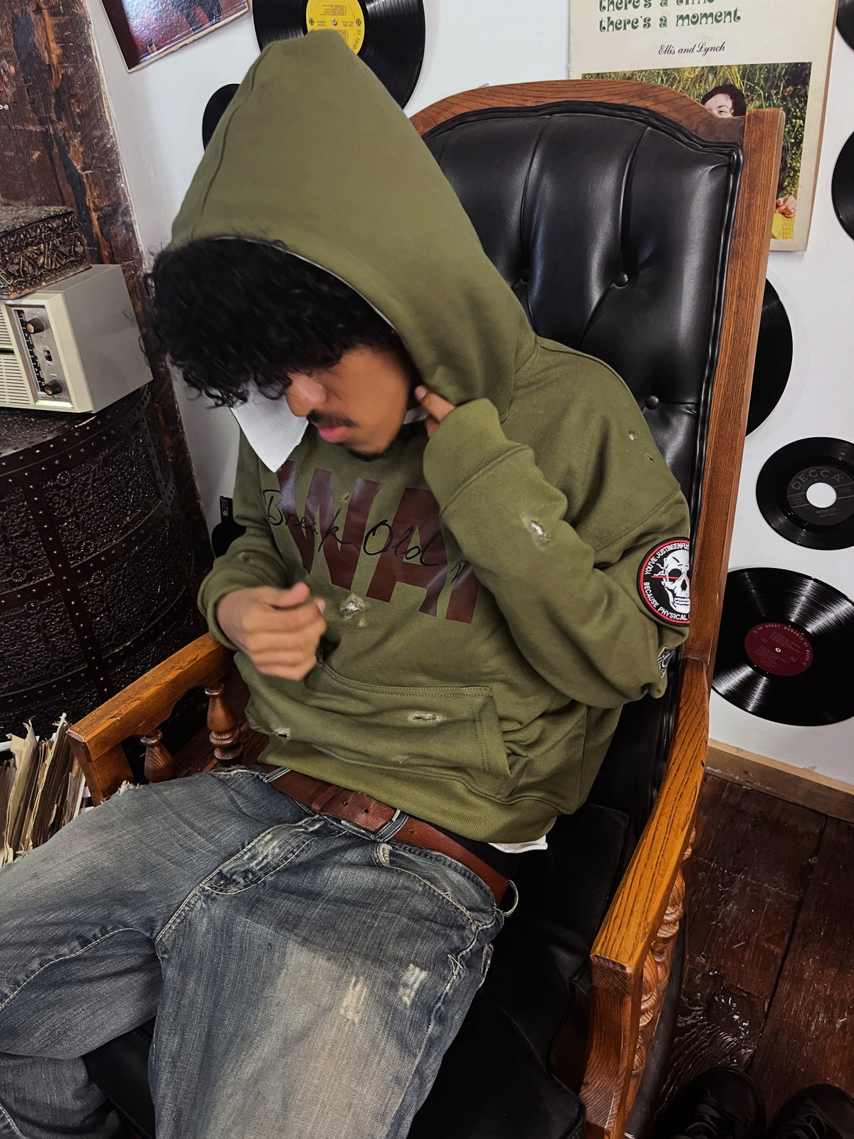 Warfare Hoodie worn with the hood up, sleeve patch visible
